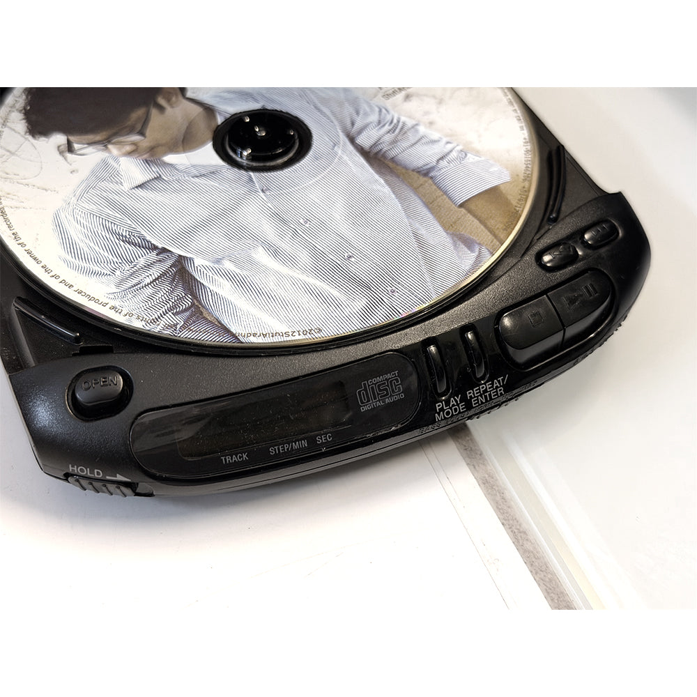 (Pre-Owned, Very Good) Sony Discman D-143 Portable CD Player (Gray) (60 Days Warranty) + 1 Music CD